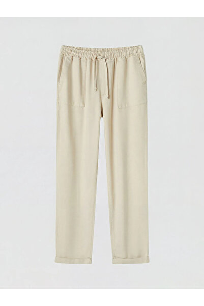 LC Waikiki Γυναικείο τζιν παντελόνι Carrot Fit με ελαστική μέση σε μπεζ χρώμα