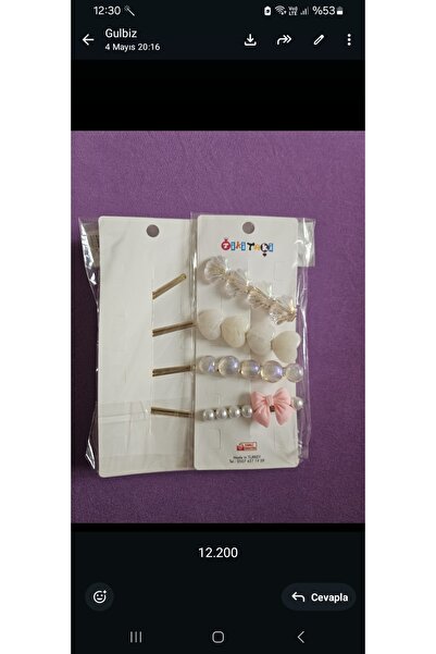 No branded Bead and bow patterned set of four children's hair clips.