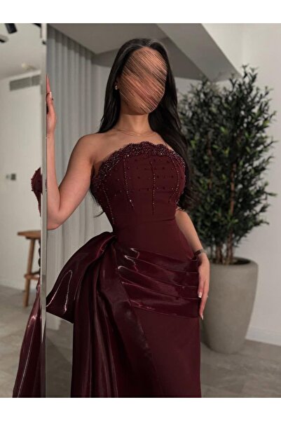 Moda Line A burgundy satin evening gown with a regal design and luxurious han...