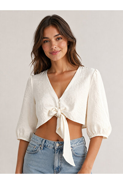 Butik Önden düğme ve bağlama detaylı balon kol crop bluz