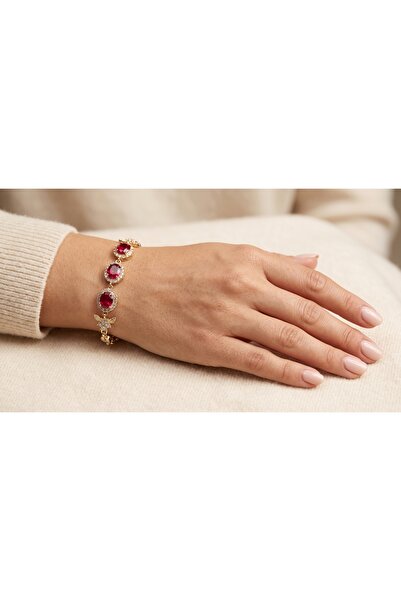 robel Bracelet with Oval Ruby Trio and Diamond‑Style Wing Motif