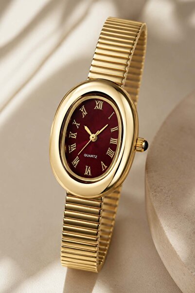 The Watch ساعة نسائية من ساوداد بسوار من الفولاذ الذهبي مع قرص أحمر داكن - هي...