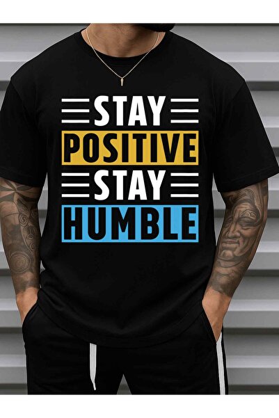 NOURAM تي شيرت رجالي بطباعة 'Stay Humble' مضحك - 180 جرام، 100% قطن، أسود بأك...