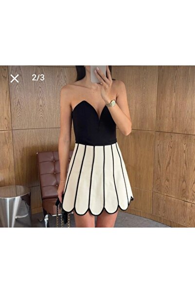 Butik Beyza تنورة كريمية قصيرة بخطوط سوداء