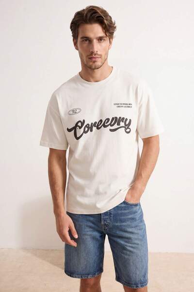 Trendyol Collection Ecru Oversize/Wide Fit Slogan Printed Tok Fabric T-Shirt ...