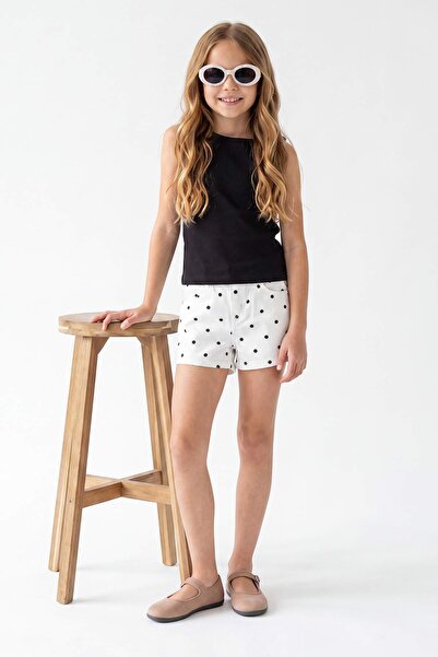 TRENDYOLKIDS Weiße gepunktete Jeansshorts und Bermuda für Mädchen TKDSS26SR00033
