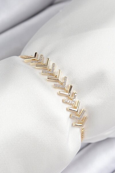 Inure Jewelry سوار نسائي من حجر الزركون النحاسي على شكل سهم ذهبي اللون