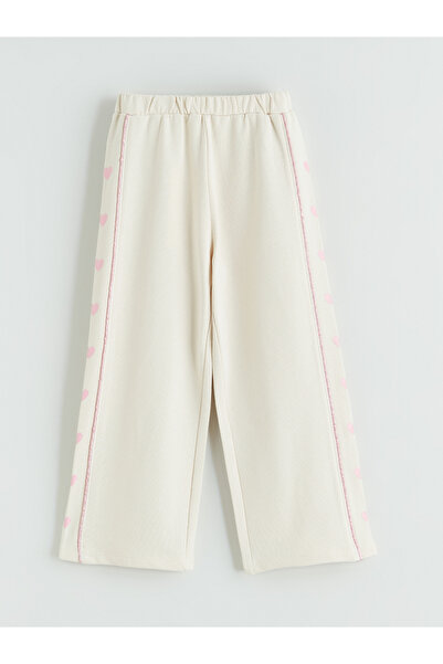 LC Waikiki Girls' wide-leg sweatpants with a heart print.