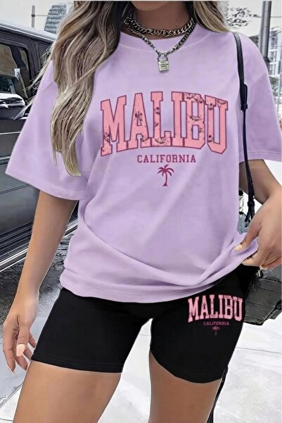 NO 601 تي شيرت نسائي كبير الحجم باللون الأرجواني الفاتح مطبوع عليه Malibu، طق...