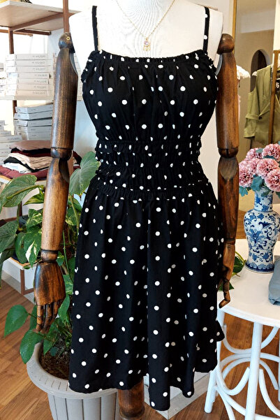 Unique Boutique فستان أسود منقط
