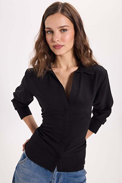 Tudors Women's slim fit black shirt with waist and back tie detail