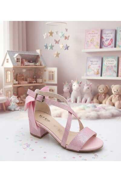 SGF KIDS Pink Cross-Sand Glittery Evening Dress Shoes with a Bow on the Back and a Single Strap Heel.