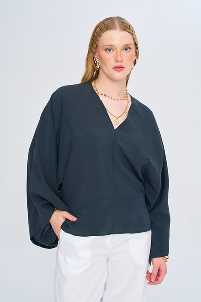 Orfeo Negro Women's Asymmetrical Cut V-Neck Solid Color Flowy Blouse