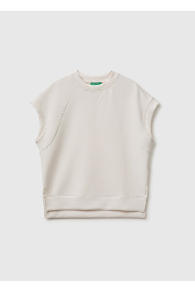 United Colors of Benetton بلوزة نسائية كريمية اللون بأكمام قصيرة وفتحة رقبة د...