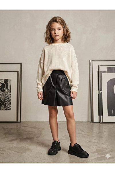 nk kids 8-14 تنورة جلدية سوداء