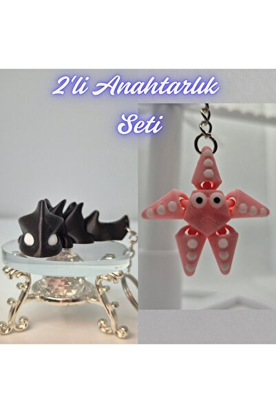 3DAtölyeMaker Black Flexible Dragon and Pink Moving Starfish Keychain