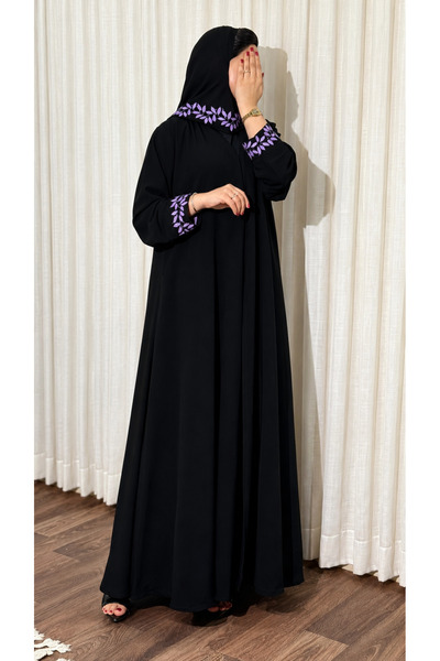 Ms Royal Abaya with a Straight Cut and Leaf-Patterned Hem.