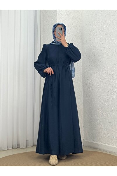 MİHRA STORE فستان من قماش الفوال بتفاصيل خياطة وتفاصيل مطاطية على أطراف الأكم...