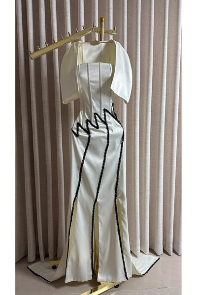 Model Leyna Luxurious White Evening Gown Featuring a Soft Satin Finish and a ...
