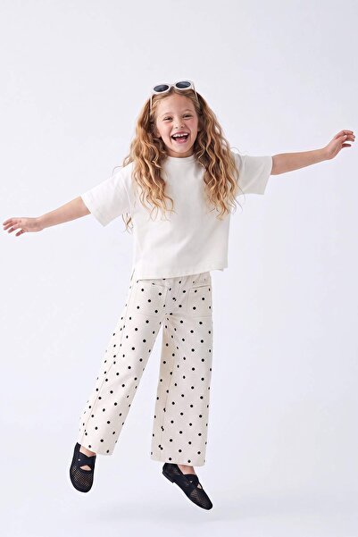 TRENDYOLKIDS Ecru Mädchen-Jeanshose mit Polka Dots und ausgestelltem Bein TKD...