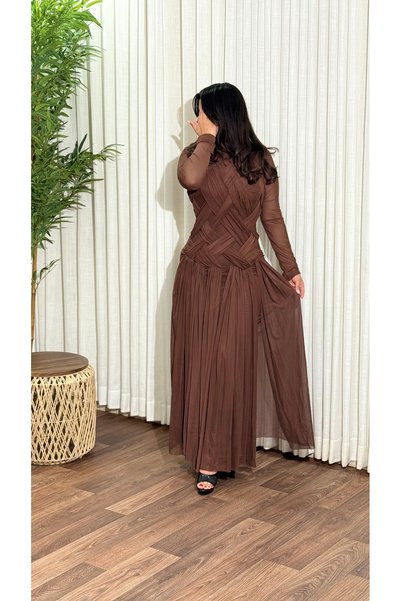 TREASUREISLAND An evening dress featuring a bodice with cross-draped fabric details.