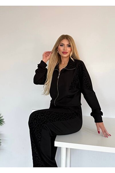Bella Belluci بدلة مرنة بخصر مرتفع وتفاصيل جلد الفهد مع سحابات
