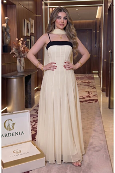 Gardenia Fashion فستان سهرة كريمي اللون مع حواف سوداء