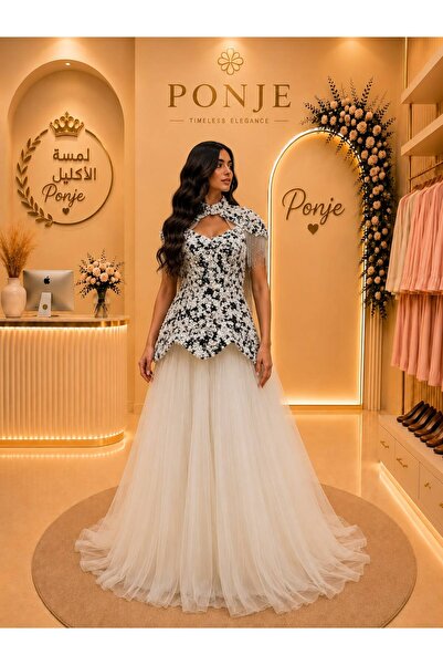 genric فستان سهرة فاخر يجسد قمة الأناقة والرقي.