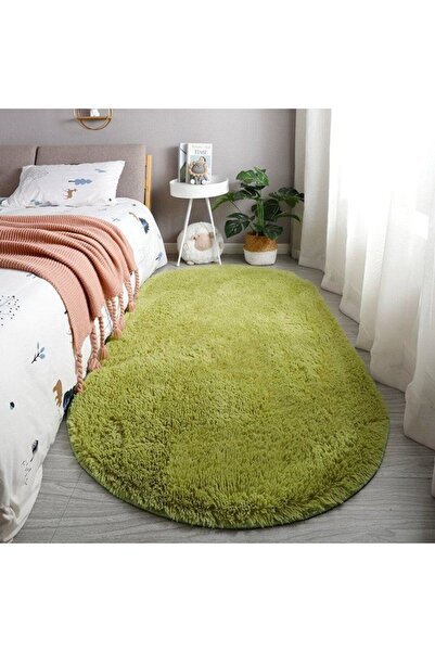STARSTAR This oval-shaped, long-pile rug is green, stain-resistant, and slip-...