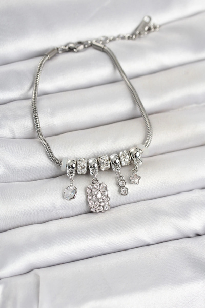 Clariss Brass Silver Color Women's Bracelet with Flower Detail and Charm