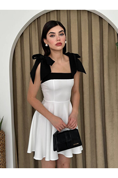 Moda Days فستان نسائي أبيض قصير بياقة مربعة وتفاصيل فيونكة على الكتف وتفاصيل ...