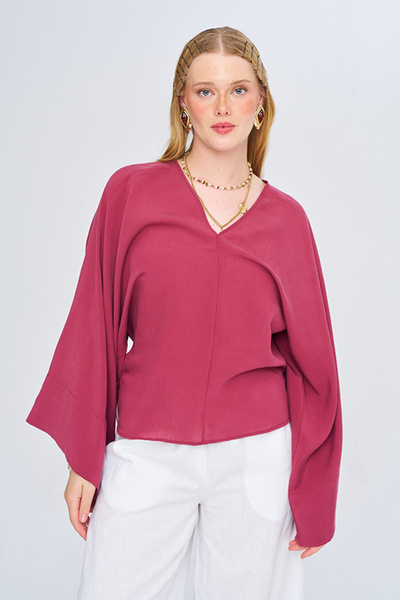 Orfeo Negro Women's Asymmetrical Cut V-Neck Solid Color Flowy Blouse