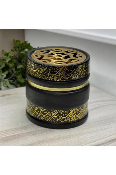 co arma An incense burner designed in an Islamic style with Arabic calligraphy.