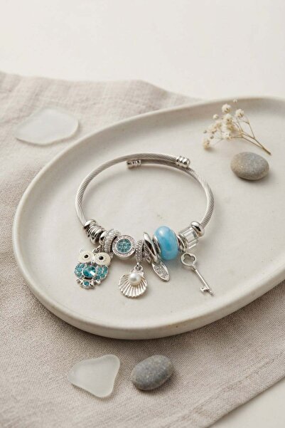 Inure Jewelry سوار فضي اللون مع حلية على شكل بومة زرقاء