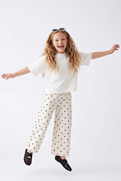 TRENDYOLKIDS Pantaloni din denim evazați cu buline pentru fete, ecru TKDSS26P...