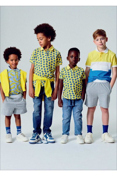 United Colors of Benetton قميص بولو مطبوع بالكامل للأطفال