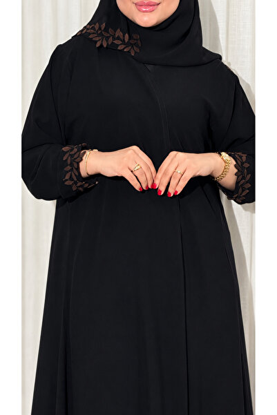 Ms Royal Abaya with a Straight Cut and Leaf-Patterned Hem.