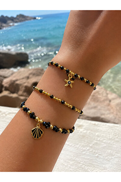 JEWELRY طقم أساور من 3 قطع بتفاصيل نجم البحر والصدف باللون الأسود والذهبي - م...