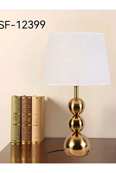 Generic This Is a Gold-Colored Table Lamp with a Base Consisting of Three Sta...