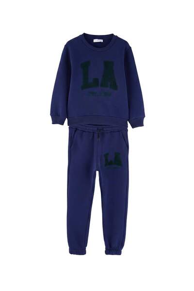 TRENDYOLKIDS Najlonski plavi set pletenog donjeg i gornjeg dela sa sloganom T...