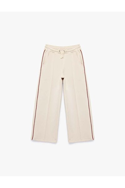 Koton Pantaloni pentru fete, bej, cu șnur, cu croială largă 6SKG40078AK