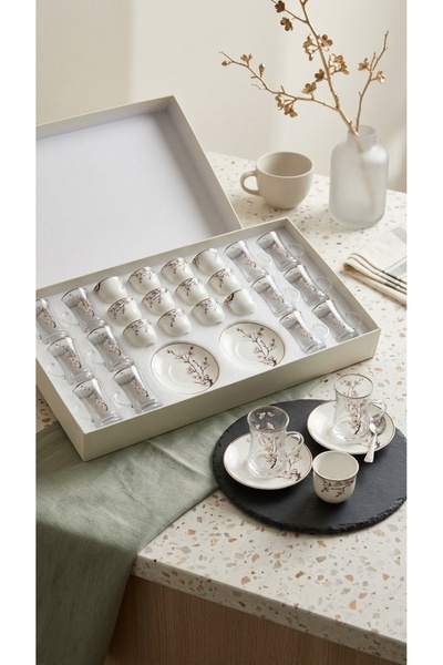 Generic A luxurious hospitality set – coffee cups and tea glasses with elegan...