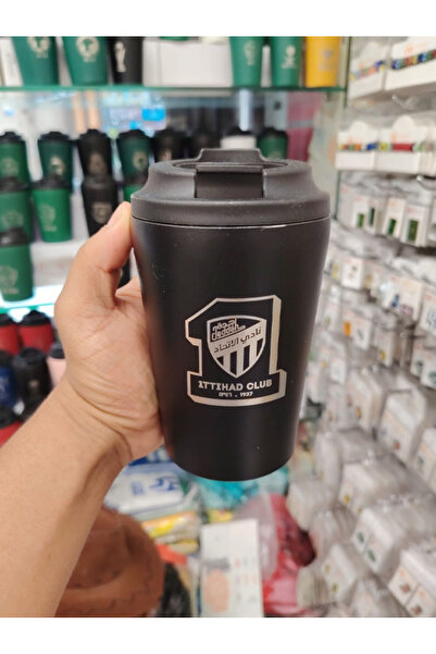 Generic This black thermal cup carries the logo of al-ittihad saudi club prin...