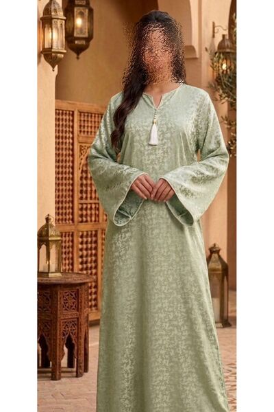 ISHRAQAT AL-AMAL A Long, Elegant Robe with a Quiet, Luxurious Oriental Touch,...