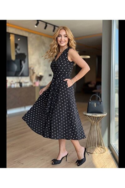 tülaybutik فستان نسائي بطول متوسط من قماش المودال ذو ياقة مزدوجة وجيوب منقطة