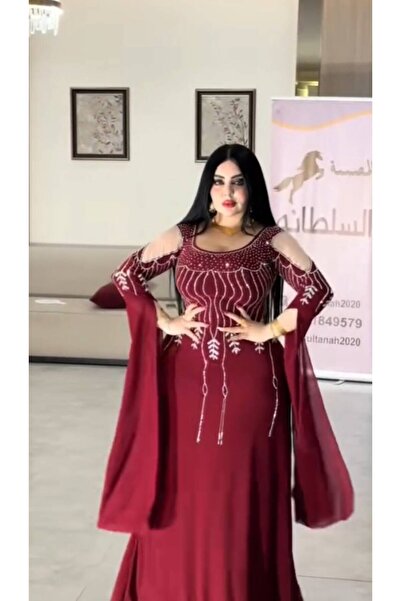 NALA FASHION The Wine-Colored Dress Features a Long, Flowing Design That Reac...