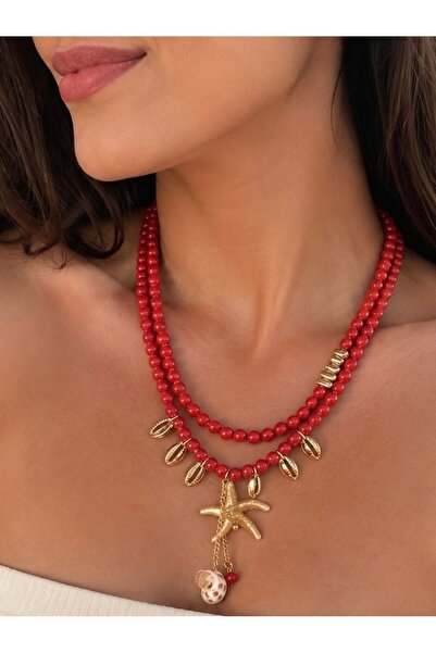 ANKA JEWELLRY قلادة نسائية من الفولاذ بتفاصيل نجم البحر وصدفة البحر مع خرز أحمر