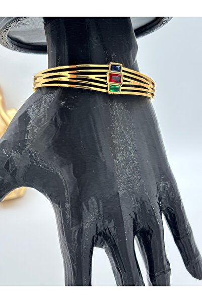 nftart.design سوار نسائي عصري من الفولاذ الذهبي مع تفاصيل حجرية ملونة