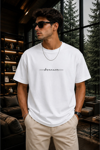 Clothify تي شيرت كبير الحجم للجنسين مطبوع عليه علامة Dreamer مصنوع من القطن ب...