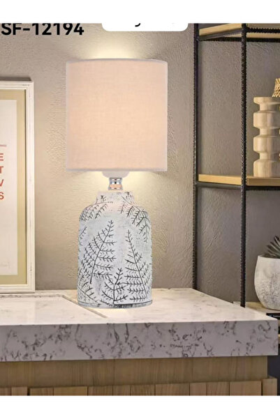 Generic This Is a Table Lamp Featuring a White Ceramic Base with Dark Leaf Pa...